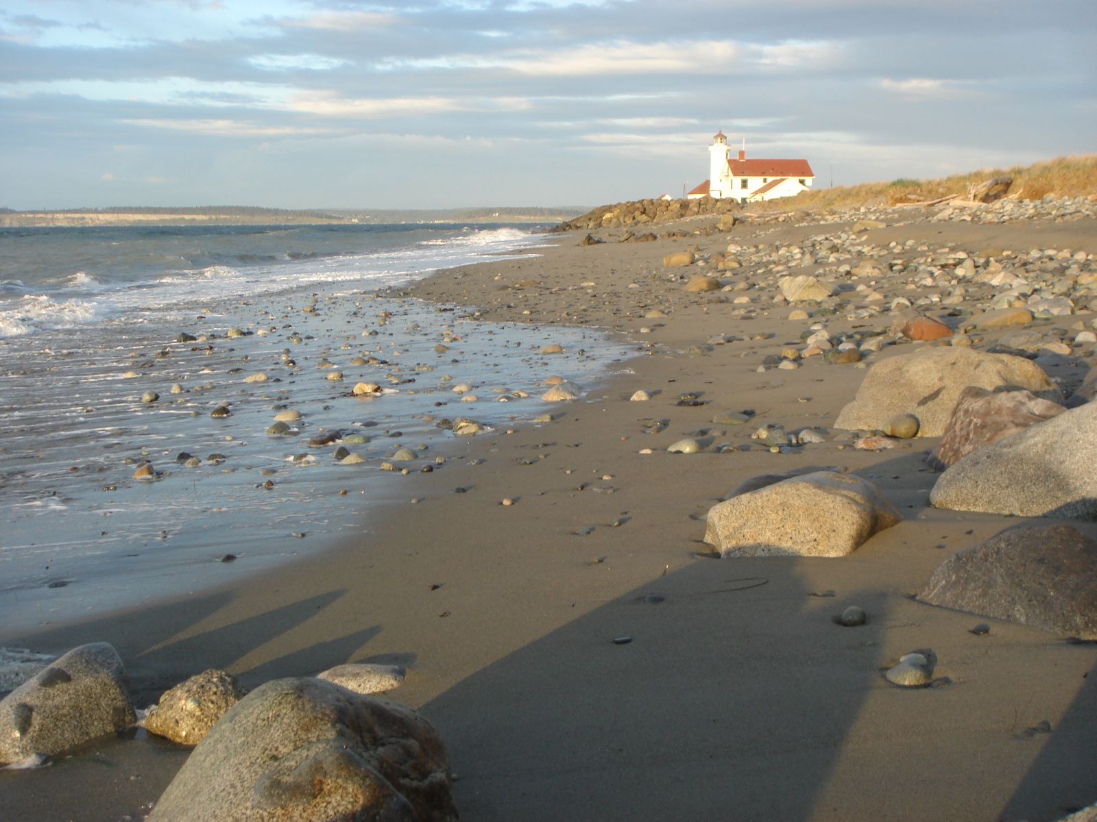 Point Wilson Lighthouse at Fort Worden with beach.